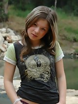 Emily stripping down near a riverkitchen